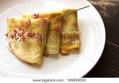 Maslenitsa traditional Russian pancakes - blini on a white plate of wood table