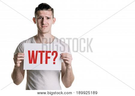 A Young Handsome Guy With A Sheet Of Paper With The Inscription 