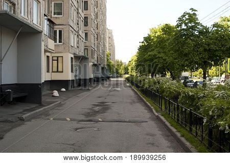Saint Petersburg Russia - 06 June 2017. Apartment building in Saint-Petersburg on the Big Porohovsky street. Blooming lilacs.