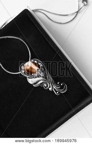 Vintage silver pendant with amber and diamonds in jewel box