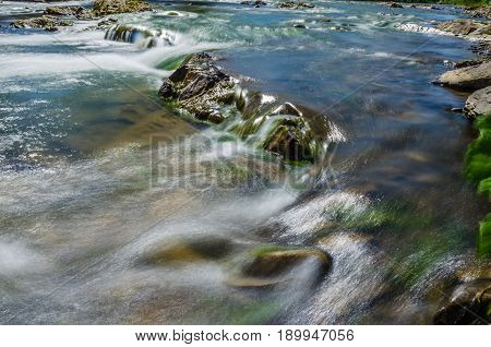 Background Of Carpathian Mountain River With Long Exposure