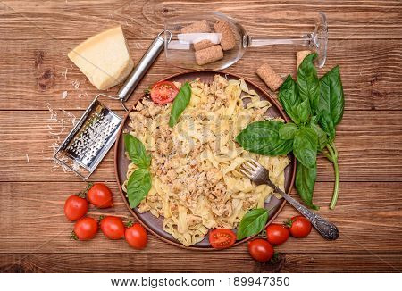 Traditional Italian pasta, served with a meat-based sauce .