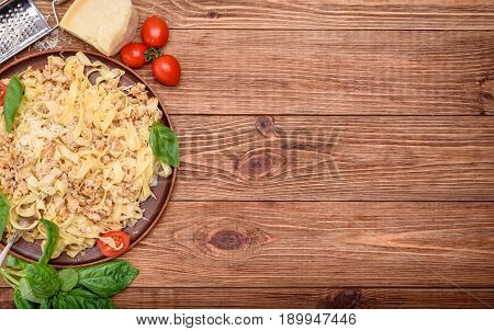 Traditional Italian pasta, served with a meat-based sauce .