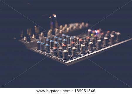 Music sound mixer console. Sound system equalizer buttons.