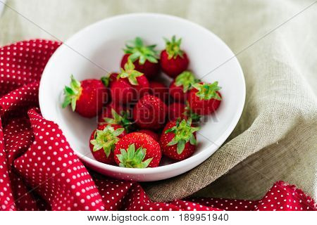 Fresh raw healthy diet strawberries fruit in plateisolated on whiteview aboveflatlay close-upcopyspace for textframe.Village rustic canvascountryside food