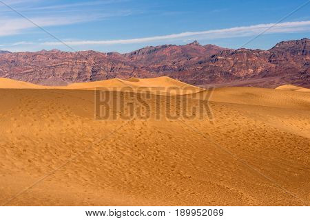 Footsteps in the sand on a beautiful day in Death Valley neaar Stovepipe Wells