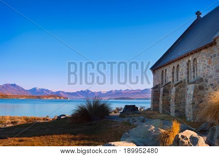 Colorful Autumn View Of Lake Tekapo With Church Of Good Shepherd