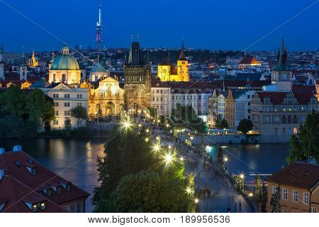 View of Charles Bridge and Vltava river in Prague, Czech Republic during blue hour. .