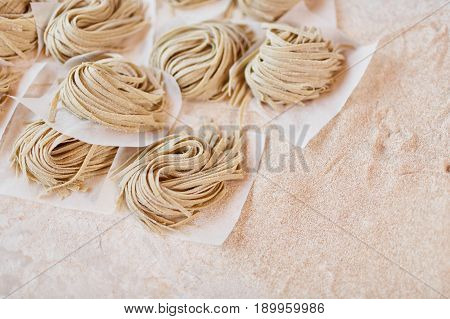 Close-up taglatelle pasta. Horizontal close-up shot of taglatelle pasta on table.