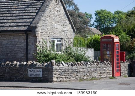 CORFE CASTLE, UK - 1st JUNE, 2017: Village of Corfe and ruins of Corfe Castle, in Swanage, Dorset, Southern England 
