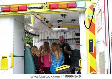 Beaulieu, Hampshire, Uk - May 29 2017: Paramedic In An Ambulance Addressing Visitors To The 2017 999