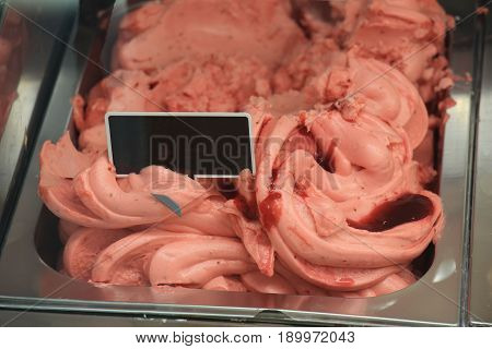 Strawberry ice cream flavour on display in a shop
