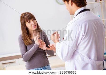 Deaf-mute female patient visiting young male doctor 