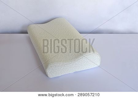 Modern Pillow On A Foam Base On A Light Background Close-up.