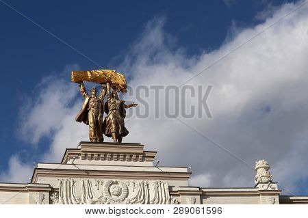 Moscow, Russia - March 2019: Restored Statues Of Tractor Driver And Collective Farm Girl On Top Of A
