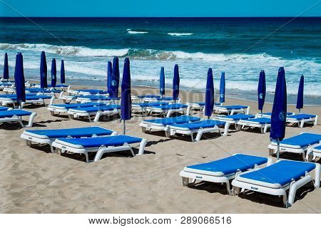 Empty Beach Umbrellas And Chairs On An Empty Sandy Coast Early In Spring At Limassol Cyprus