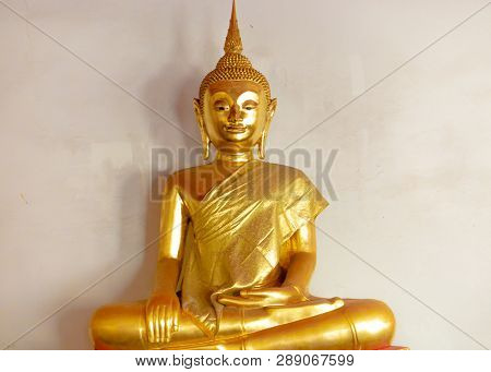 Golden Buddha Satue In A Buddhist Temple Thailand