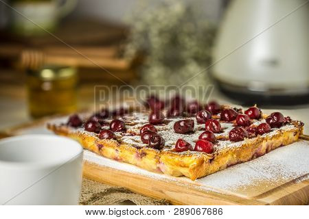Clafoutis Cherry Pie On Wooden Background. Klafuti French Cherry Pie.