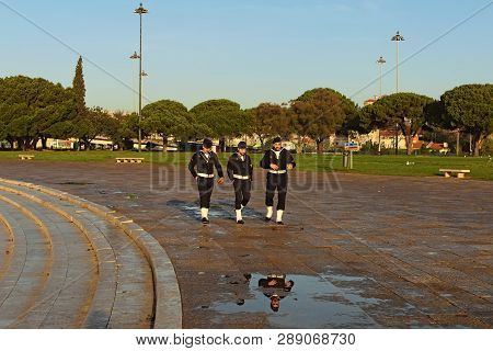 Lisbon, Portugal-december 29, 2015: Three Sailormen Walking Proud Near Belem Tower.