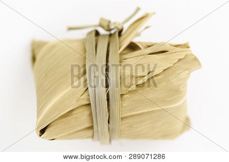 Qi Men Red Tea In Dry Leaves Package Overhead View