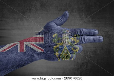 Pitcairn Islands Flag Painted On Male Hand Like A Gun