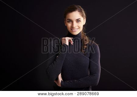 Beautiful Smiling Woman Posing At Isolated Black Background