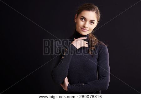 Beautiful Smiling Woman Posing At Isolated Black Background