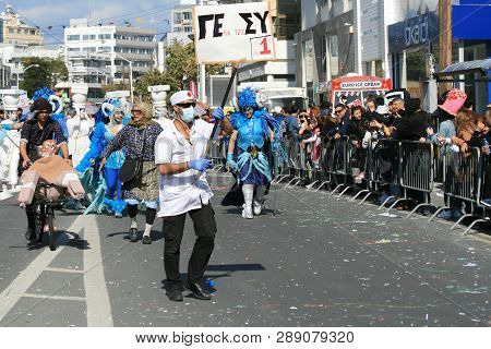 Limassol, Cyprus, March 10th, 2019: Man In A Doctor Costume In Front Of A Group Of People In Fancy D