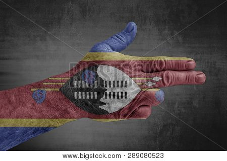 Swaziland Flag Painted On Male Hand Like A Gun