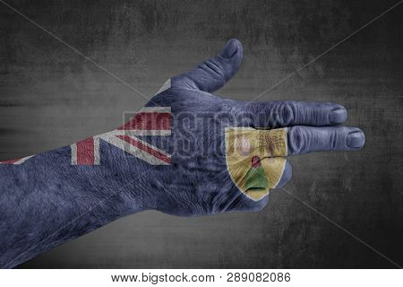 Turks And Caicos Islands Flag Painted On Male Hand Like A Gun