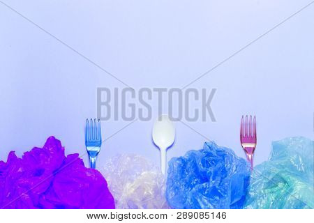 Plastic Cutlery And Plastic Bag In Plate. Setout With Plastic Garbage.