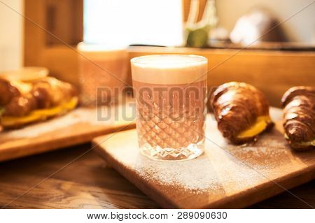 Original Authors Coffee On Beet Milk And Fresh Croissant With Fruits On Wooden Plate On Table. Healt