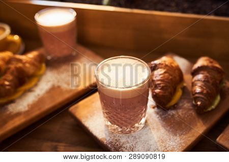 Original Authors Coffee On Beet Milk And Fresh Croissant With Fruits On Wooden Plate On Table. Healt