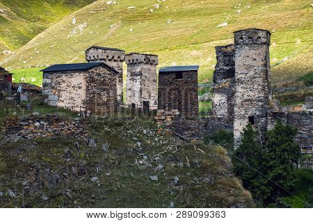Murkmeli Village In Ushguli Community With Meadows On The Background