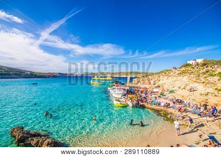 Comino, Malta - November, 2018: Tourists Crowd At Blue Lagoon To Enjoy The Clear Turquoise Water On