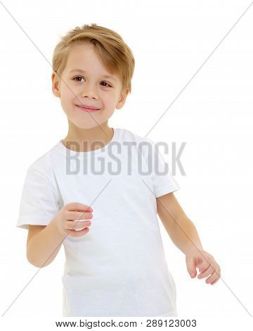 A Cute, Emotional Little Boy In A Clean White T-shirt. On Which You Can Write A Company Logo Or Adve