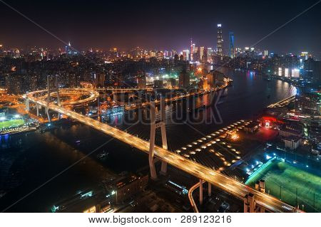 Shanghai Nanpu Bridge over Huangpu River with busy traffic in China.