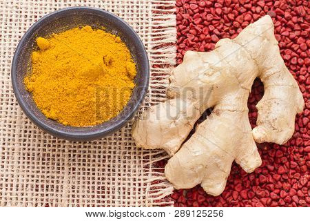 Turmeric And Ginger On Sackcloth And Annatto Seeds