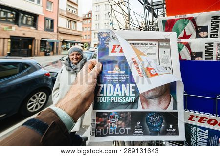 Paris, France - Mar 12, 2019: Man Buying Pov At French Lequipe Team Sport Newspaper With Zinedine Zi