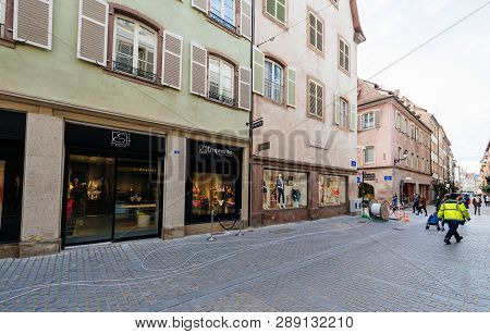 Strasbourg, France - Mar 12, 2018: Pedestrians Near Fiber Optic Installation In Central City Pedestr