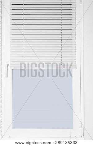 Modern Window With Half-closed Stylish White Blinds