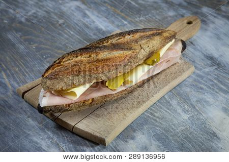 Ham And Cheese Sanwdich In A French Baguette, Made Of Paris Ham And Emmental With Some Sliced Pickle