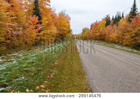 Diminishing Two Lane Road. Rural Asphalt Highway Through An Autumn Forest In The Hiawatha National F