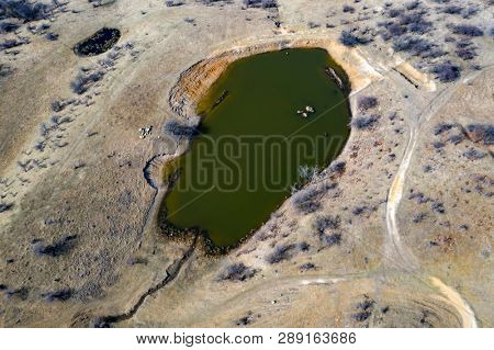 Topdown view from drone on a small lake.