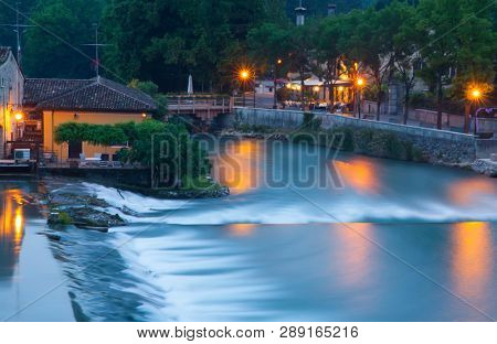 Panoramic night view of Borghetto (Valeggio sul Mincio, Verona) from the bridge on the river Mincio