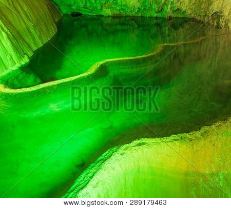 Cave Lake Nature Background. Amazing Cave Lake Nature Background. Artificial Green Lights In Cave. N