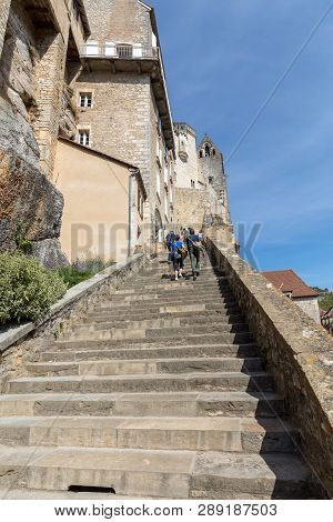 Rocamadour, France - September 3, 2018: People On Steep Steps Big Stairs At Pilgrimage Town Of Rocam