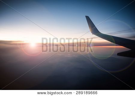 Airplane Wings In The Sky And A Mountains View Scene In The Sunr