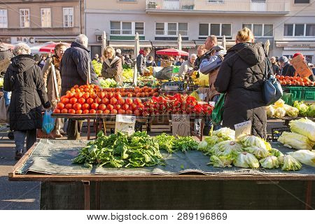 Zagreb, Croatia - December 29th 2018. Customers Shop For Fresh Fruit And Vegetables At The Dolac Mar