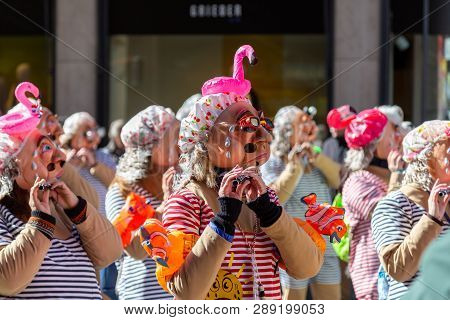 Basel, Switzerland - March 11, 2019: Participants At The Parade Of The Carnival Of Basel. The Carniv